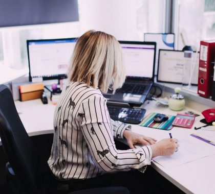 Woman Doing Bookkeeping in an Office Setting